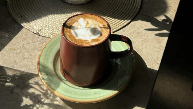 Homemade latte at home on counter with Sacred 7 Mushroom Powder inside